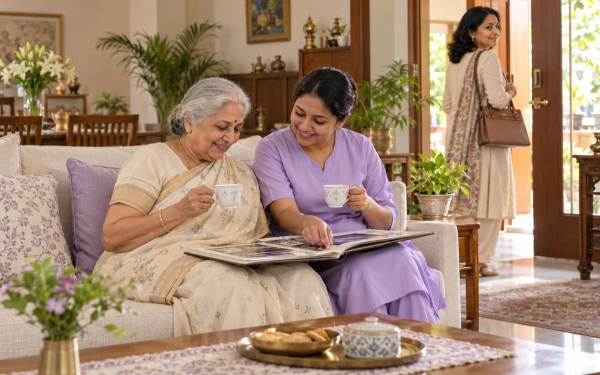A Kareverse caretaker sitting with an older woman at home