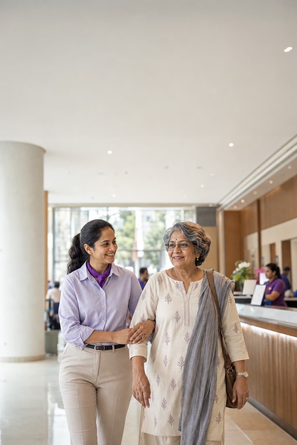A Kareverse Genie accompanying an elderly parent at a Bangalore hospital