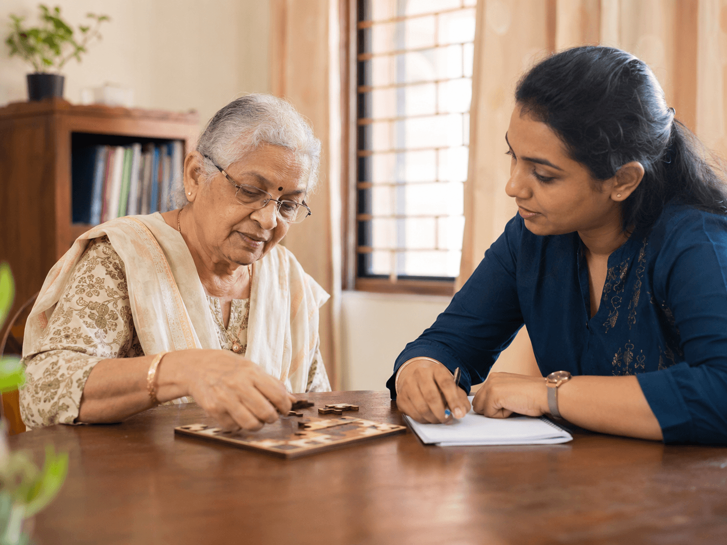 Care Manager conducting a longevity assessment with a senior at home